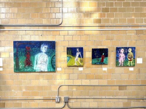 Gallery wall displaying (L to R) "Red dress #3," "Uphill path," "Woman with Ladder," "Offering"