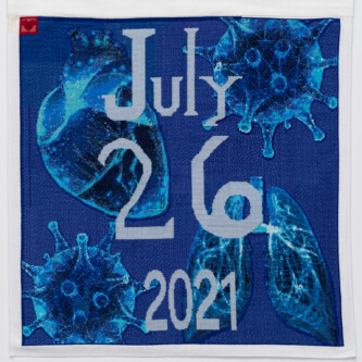 Cross stitch embroidery with "July 26 2021" down the middle. A human heart, two COVID virus images, and a set of lungs are embroidered in blue threads in behind the lettering. The background is royal blue. A red square is stitched in the top left corner with a small heart shape inside.